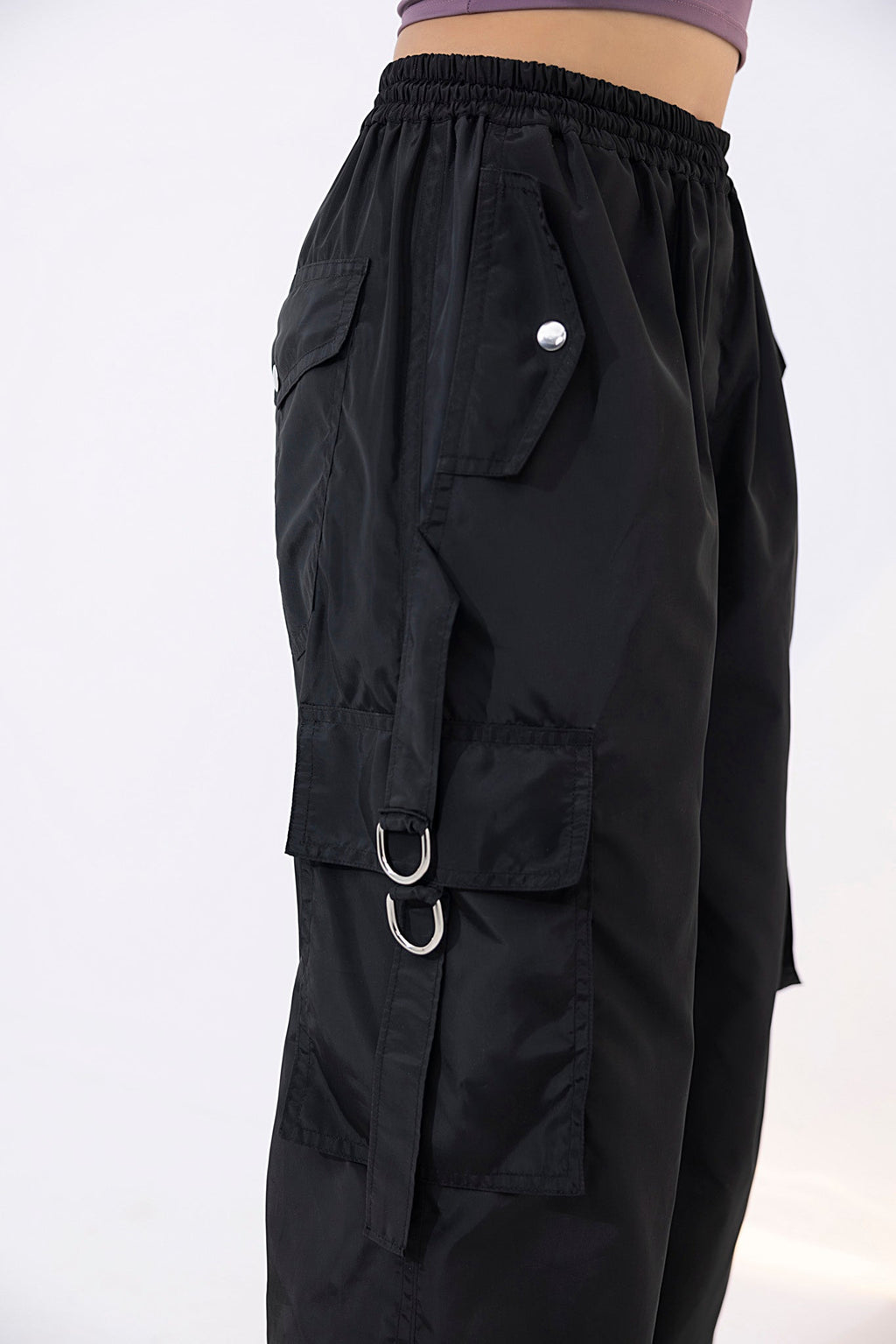 Women's black parachute cargo pants.