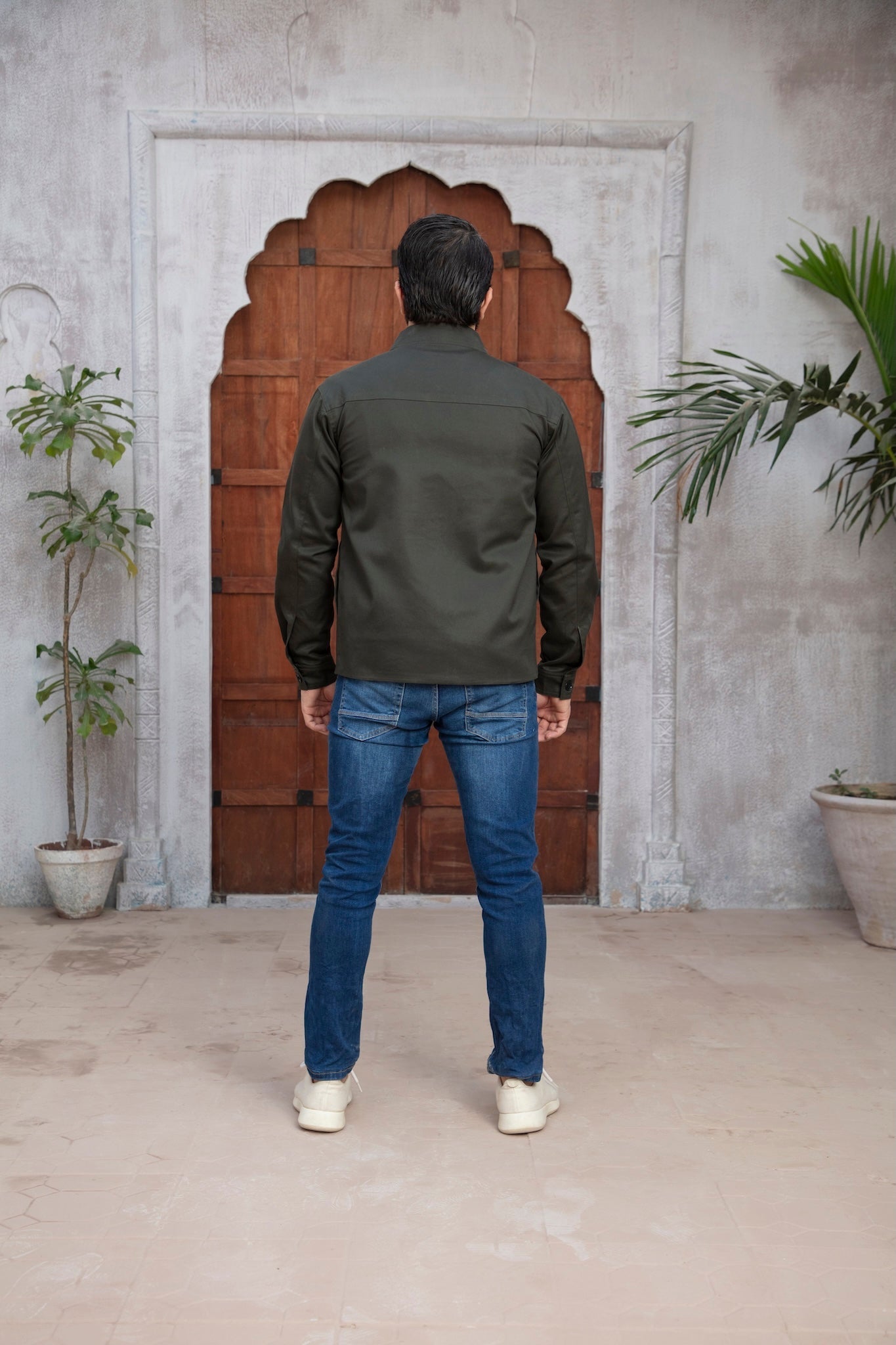 Men wearing green jacket with back pose