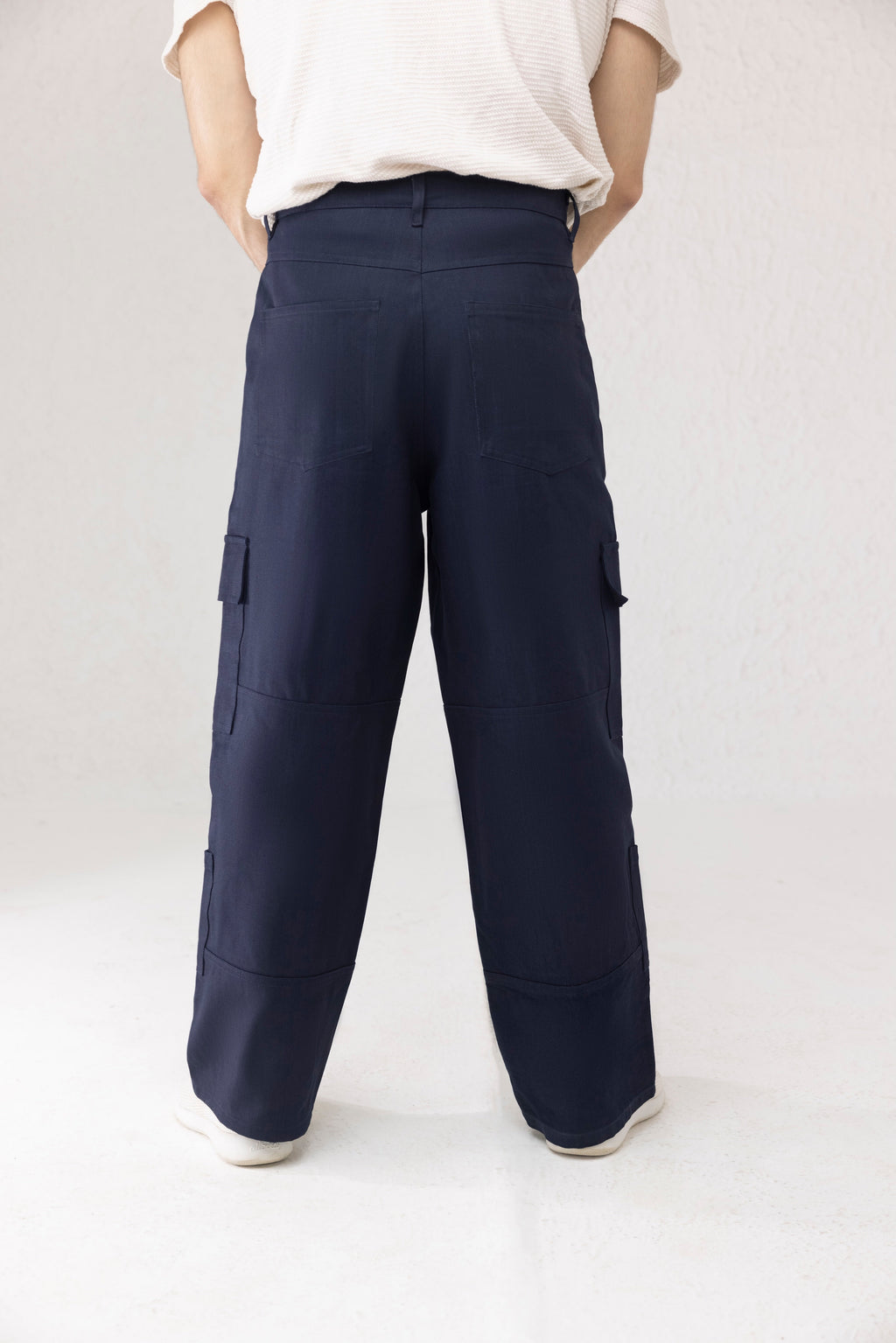 Back view of navy twill men’s cargo pants in wide leg fit – Aether by Decuir