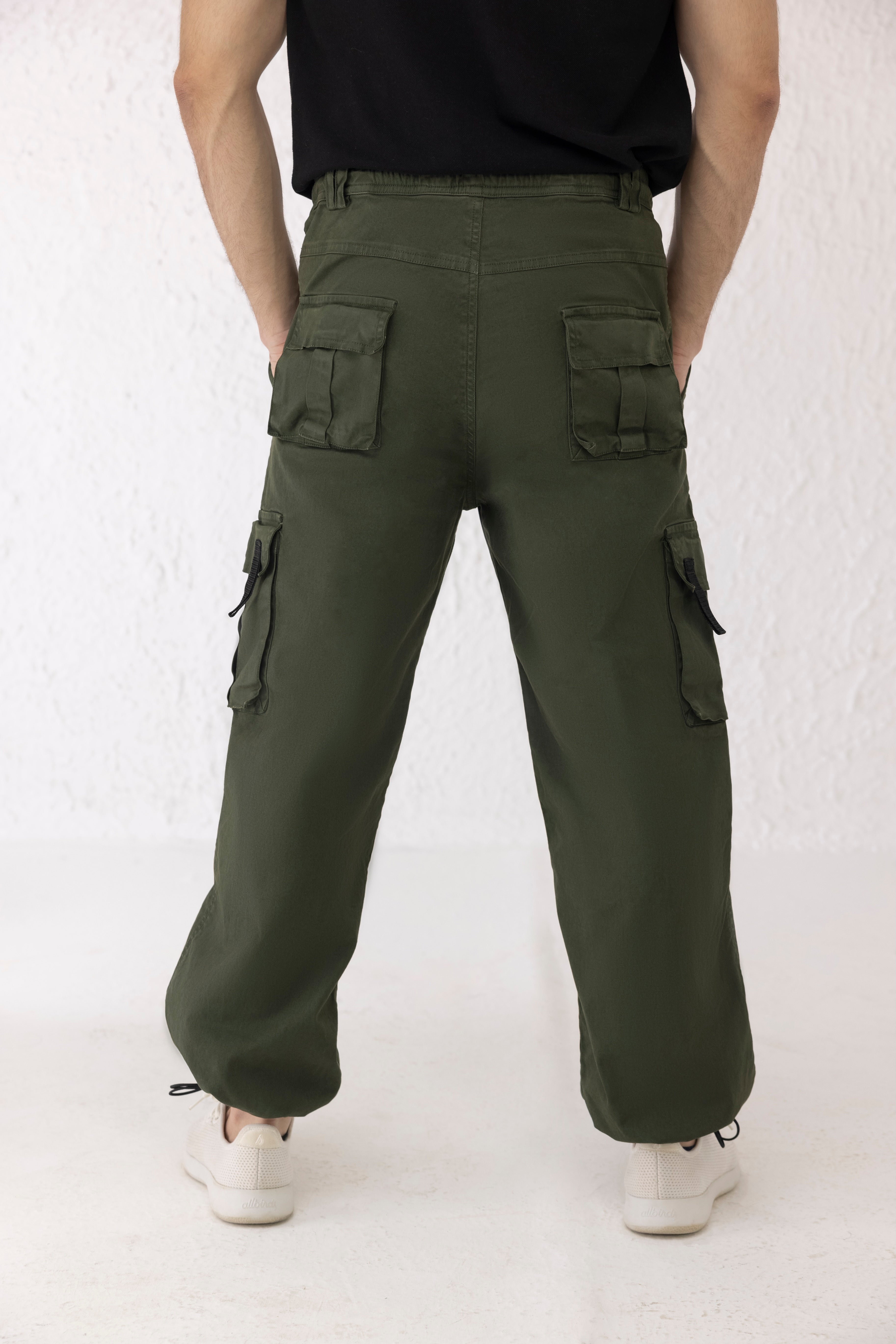 Back view of Everstride dark green men’s cargo pants made from durable twill fabric